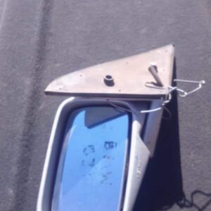 Left side exterior mirror for BMW E36, shown from front angle, used condition with mounting bracket visible.Le