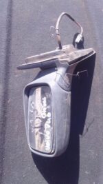 Left side exterior mirror for Volvo V40, used condition, shown from an angled perspective.Left side exterior m