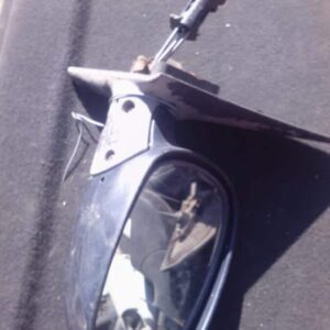 Right side car door mirror assembly shown from front angle, used condition visible on reflective surface.Right