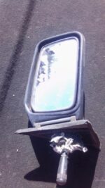 Right side car mirror for Honda Ballade, used condition, angled to show reflective glass and housing details.R