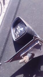 Right side exterior mirror for Suzuki Swift, angled to show glass and housing, used condition.Right side exter