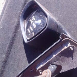 Right side exterior mirror for Suzuki Swift, angled to show glass and housing, used condition.Right side exter