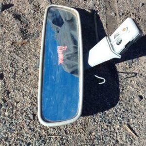 Rear view mirror for Toyota Runx shown from front angle, used condition.Rear view mirror for Toyota Runx shown
