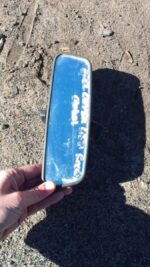 Rear view mirror for Opel Corsa, shown from front angle, used condition.Rear view mirror for Opel Corsa, shown