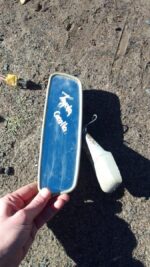 Rear view mirror for Toyota Corolla shown from front angle, used condition.Rear view mirror for Toyota Corolla