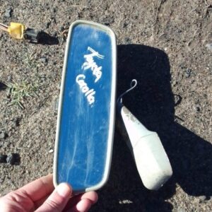 Rear view mirror for Toyota Corolla shown from front angle, used condition.Rear view mirror for Toyota Corolla