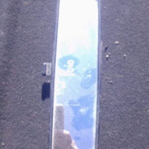 Rear view mirror for Volkswagen Polo Vivo, shown from front with mounting arm, used condition.Rear view mirror