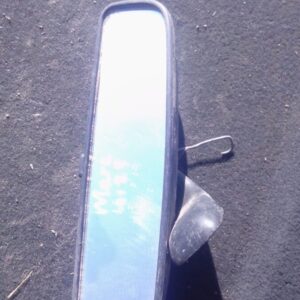 Used rear view mirror for Mercedes W123 shown from a front angle highlighting reflective surface and frame.Use