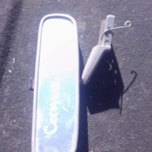 Used rear view mirror for Toyota Conquest shown front-facing against a plain background.Used rear view mirror