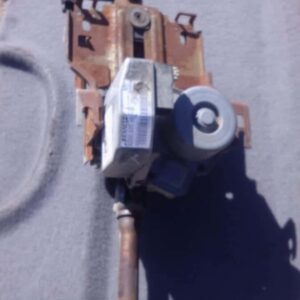 Used electric steering column for Renault Clio 3, shown from side angle, ready for installation.Used electric