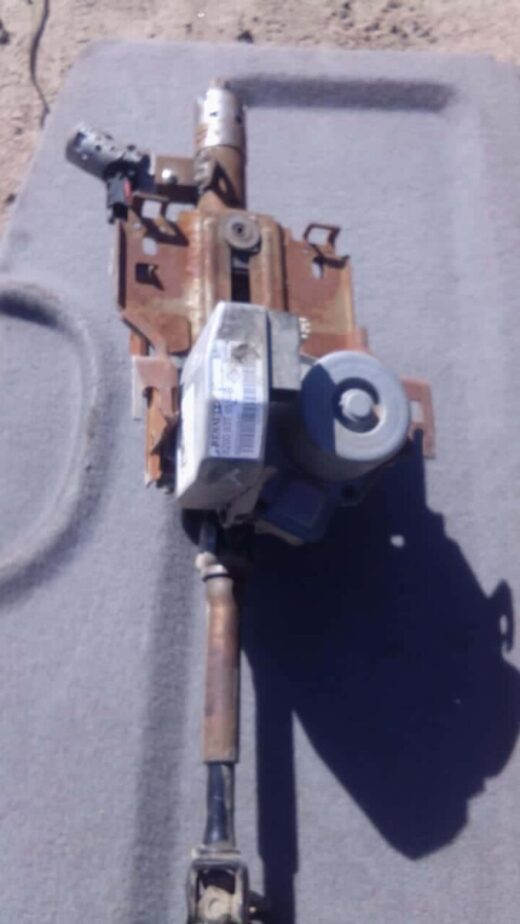 Whatsapp Image 2024-06-11 At 12.05.28 (1) Used electric steering column for Renault Clio 3, shown from side angle, ready for installation.Used electric