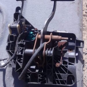 Used car pedal viewed from the side, showing mounting points and footrest surface.Used car pedal viewed from t