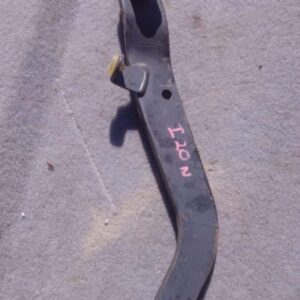 Close-up of a used Hyundai i20 brake pedal showing mounting bracket and pedal arm from side angle.Close-up of