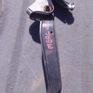 Close-up of a used brake pedal assembly from a Mercedes W204, viewed angled from the side against a white back