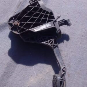 Used clutch pedal assembly positioned upright showing mounting bracket and pedal arm.Used clutch pedal assembl