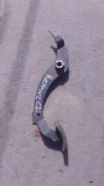 Used clutch pedal assembly for Renault Clio, shown from side angle against a white background.Used clutch peda