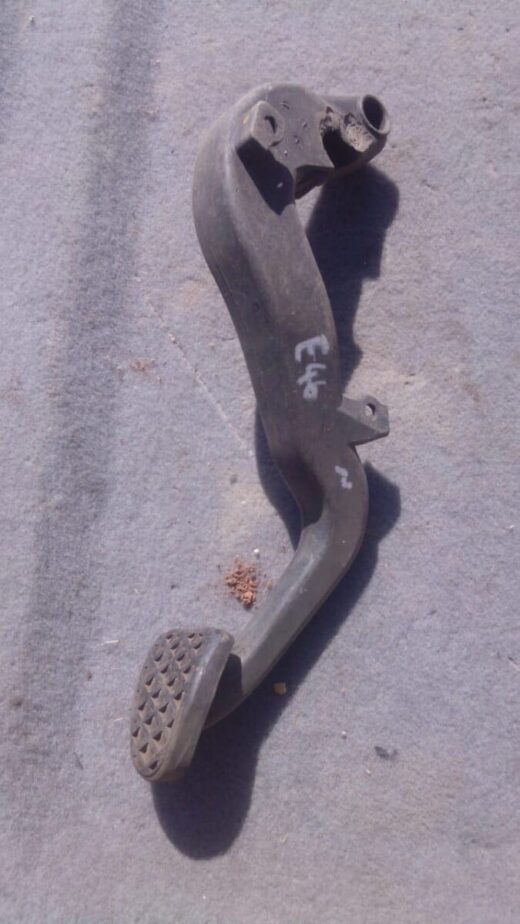 2003 Bmw E46 Brake Pedal - Used Used car brake pedal viewed from front showing pedal arm and pad on a clean white background.Used car brake pe