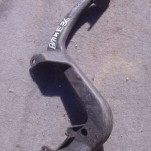 Close-up of a used BMW E36 car pedal showing wear details from a frontal angle.Close-up of a used BMW E36 car