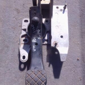 Used brake pedal for a Volkswagen Polo Vivo, angled view showing pedal and mounting bracket.Used brake pedal f
