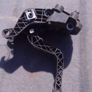 Used car accelerator pedal shown from front angle on plain white background.Used car accelerator pedal shown f