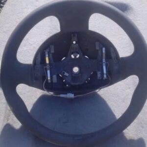 Used Renault Megane steering wheel shown from front with central horn pad and control buttons visible.Used Ren
