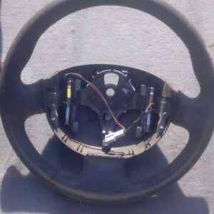 Front view of a used Renault Megane steering wheel showing the central hub, spokes, and grip sections.Front vi