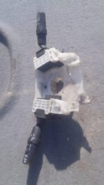 Front view of a used combination switch assembly for a 2007 Mazda 3, showing stalks and connector ports.Front