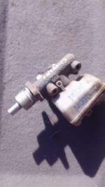 Used brake master cylinder viewed from the top, showing reservoir and mounting points.Used brake master cylind
