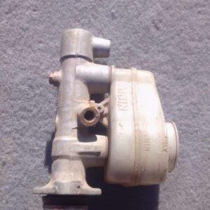 Used brake master cylinder angled front-left showing metal body and hydraulic ports for Corolla.Used brake mas