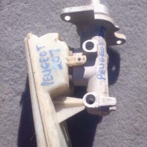 Front angled view of a used Peugeot 207 brake master cylinder showing mounting points and reservoir connection