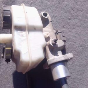 Used brake master cylinder angled front-left showing reservoir cap and mounting points for Volkswagen Polo Viv