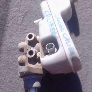 Used brake master cylinder for Dodge Caliber, shown from front angle with reservoir and mounting points visibl