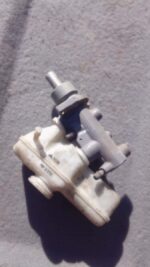 Used brake master cylinder angled front-left, showing brake fluid reservoir and mounting points.Used brake mas