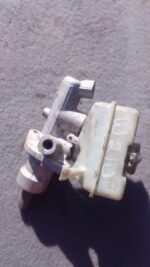 Front angled view of a used brake master cylinder for a 1996 Mercedes Benz W210.Front angled view of a used br