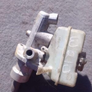 Front angled view of a used brake master cylinder for a 1996 Mercedes Benz W210.Front angled view of a used br