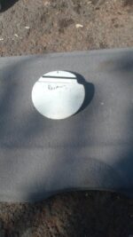 Used Renault Scenic fuel flap shown from front angle against plain white background.Used Renault Scenic fuel f