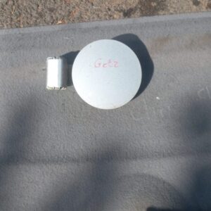 Used fuel flap for Hyundai Getz, shown closed and viewed from the outside front angle.Used fuel flap for Hyund