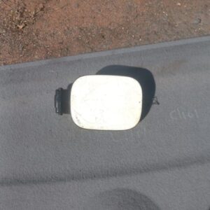 Used fuel flap for a 2006 Volkswagen Jetta, shown from the front side angle.Used fuel flap for a 2006 Volkswag