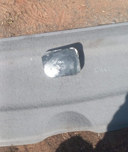 Volkswagen Jetta 2 Fuel Flap - Used Close-up of a used fuel flap for Volkswagen Jetta 2 shown from the front angle.Close-up of a used fuel flap fo