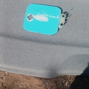 Used Toyota Cressida fuel flap shown from front angled view with latch and hinge visible.Used Toyota Cressida