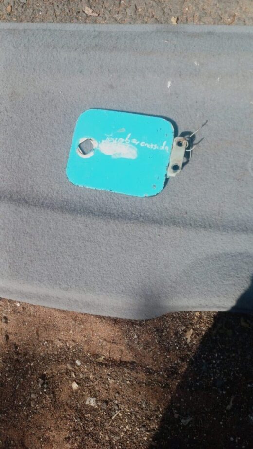 Toyota Cressida Fuel Flap - Used Used Toyota Cressida fuel flap shown from front angled view with latch and hinge visible.Used Toyota Cressida