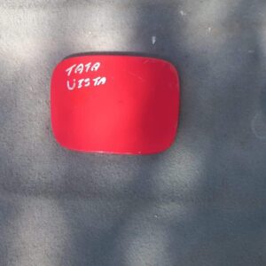 Used fuel flap for Tata Indica Vista, shown from front angle, with hinge and locking mechanism visible.Used fu