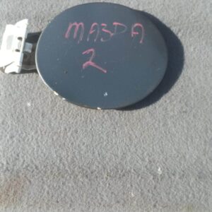 Used fuel flaps for Mazda 2, shown from front angle with visible mounting features.Used fuel flaps for Mazda 2