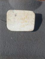 Used Mazda 323 fuel flap shown front-facing on a neutral background, suitable for replacement.Used Mazda 323 f