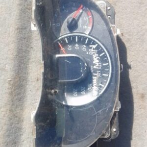 Front view of a used Nissan Micra instrument cluster with gauges and digital display panel.Front view of a use