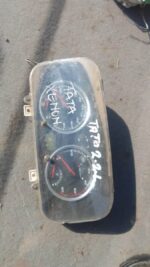 Front view of a used Tata Xenon truck cluster gauge panel with speedometer and warning lights visible.Front vi