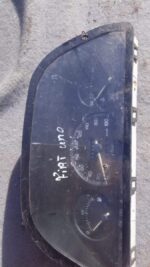 Front view of a used Fiat Uno dashboard instrument cluster showing speedometer and gauges clearly.Front view o
