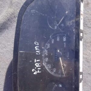 Front view of a used Fiat Uno dashboard instrument cluster showing speedometer and gauges clearly.Front view o
