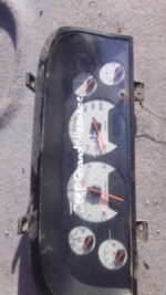 Used Jeep Grand Cherokee dashboard cluster showing front view with speedometer and gauges visible.Used Jeep Gr