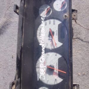 Used Jeep Grand Cherokee dashboard cluster showing front view with speedometer and gauges visible.Used Jeep Gr